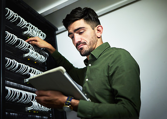 Image showing Server room, cable and engineer man with a tablet for programming, maintenance and software upgrade. Young technician person with technology in data center for problem solving and internet connection