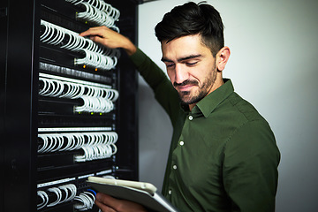 Image showing Cable, engineer man and data center with a tablet for programming, maintenance and software upgrade. Male IT technician person with technology in server room for wire, hardware or internet connection