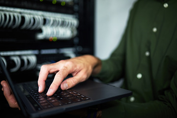 Image showing Server room hands, laptop and technician at work for cyber security and building network. Programming, coding and a person or it worker with a computer for a connection system in the workplace