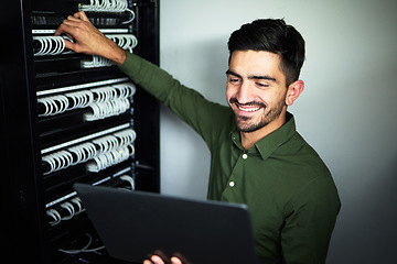 Image showing Laptop, maintenance and male technician in a server room for technical repairs by a control box. Technology, engineering and professional man electrician working on computer for cybersecurity system.