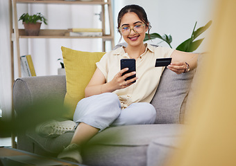 Image showing Woman, credit card and ecommerce on smartphone in home for digital payment, fintech password and online shopping. Happy female customer, mobile account and banking code for financial sales promotion