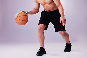 Image showing Fitness, basketball and bounce with a sports man in studio on a gray background for training or a game. Exercise, workout or dribble and healthy body of shirtless male athlete playing ball with skill