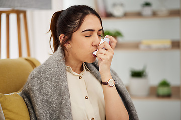 Image showing Sick, breathing and woman with a pump for asthma, medical emergency or spraying air into mouth. House, covid and a young girl with risk for healthcare, lung support or inhaler on the sofa in her home