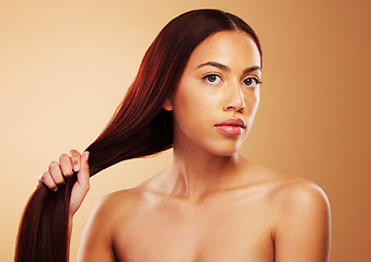 Image showing Portrait, haircare and beauty, woman with strong hair and luxury salon treatment on brown background. Natural glow, haircut and keratin growth, serious face of model in cosmetics and makeup studio.