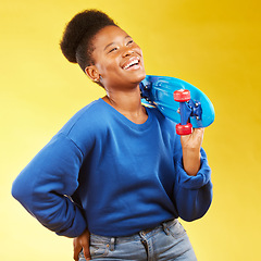 Image showing Skater, thinking or happy black woman with skateboard laughing isolated on yellow background in studio. Trendy African student, gen z or skateboarder with freedom, fun ideas or funny joke to relax