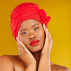 Image showing Natural beauty, woman wrap and portrait with scarf, red lipstick and wellness in studio. Yellow background, female person and face cosmetics with model and makeup for skincare and facial glow