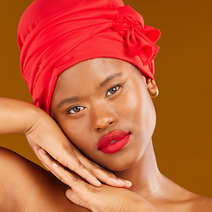 Image showing Beauty, woman and stylish wrap with face and red lips portrait and scarf for care and wellness in studio. Brown background, female person and cosmetics with African model and makeup for facial glow