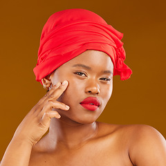 Image showing Beauty, woman and wrap with healthy face and red lips portrait and scarf for care and wellness in studio. Brown background, female person and cosmetics with African model and makeup for facial glow