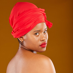 Image showing Woman, portrait and hair scarf with red lipstick for beauty, makeup and haircare in studio. Brown background, African female person and cosmetics of a model with head wrap for culture with glow