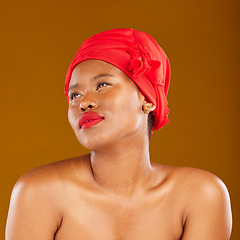 Image showing Woman, red lipstick and hair scarf with beauty, face makeup and haircare in studio. Brown background, African female person and cosmetics of a model with head wrap for culture with skincare glow