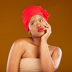 Image showing Beauty, makeup and thinking with face of black woman in studio for cosmetics, creative and pride. Skincare, salon and red lipstick with model on brown background for wellness, self care and glow
