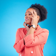 Image showing Faint, thinking and black woman with sad face, fashion and stylish outfit on a blue studio background. Female person and model feeling tired from emotion or drama in elegant clothes and trendy style