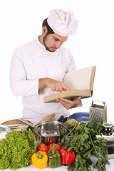 Image showing young chef preparing lunch 