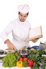 Image showing young chef preparing lunch 