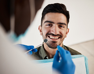 Image showing Portrait, man and hands of dentist with tools for dental, healthcare or check in clinic. Face smile, orthodontics and patient with doctor, mirror and excavator for teeth cleaning and medical hygiene