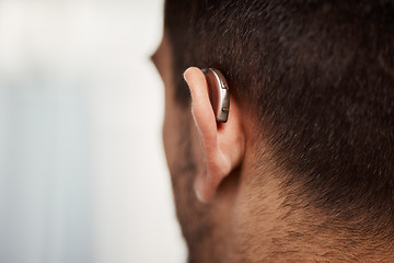 Image showing Closeup of hearing aid, ear and man with disability from the back for medical support, listening or healthcare at mockup space. Deaf patient, face and audiology implant to help volume of sound waves