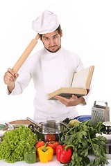 Image showing young chef preparing lunch 