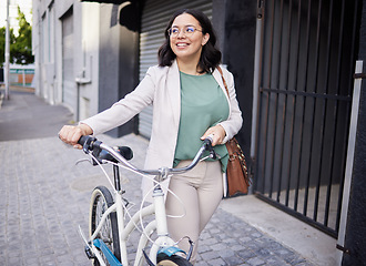 Image showing Business, woman and walking with bicycle in outdoor with smile for travel to work with marketer. Happy, business and female person with transportation for cycling to commute in city with bag for job.