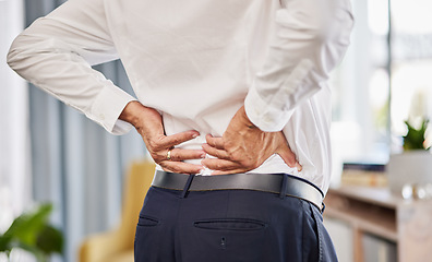 Image showing Man, office and back pain with injury or stress from accident or tired muscle with bone problem. Stretching, spine and body with business person at corporate company with working hard or exhausted.