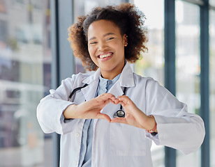 Image showing Black woman, heart and hands of doctor in portrait for healthcare, wellness and kindness. Happy female cardiology worker, finger shape and trust for love emoji, icon and thank you in medical hospital