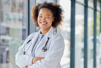 Image showing Happy black woman, portrait and doctor with arms crossed in clinic for wellness services, help or medical consulting. Medicine, healthcare and young female professional working with trust in hospital