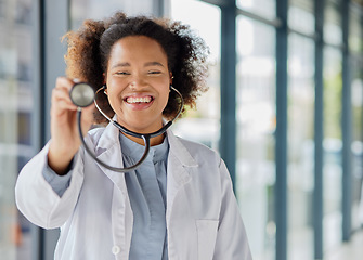 Image showing Doctor, portrait and woman listening with stethoscope for heartbeat, healthcare and cardiology. Happy black female medical worker with tools to check heart, lungs or breathing test for help in clinic