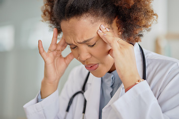 Image showing Headache, tired doctor and black woman in hospital with burnout, clinic problem and challenge of stress. Face of frustrated female healthcare worker with fatigue, migraine pain and anxiety of mistake