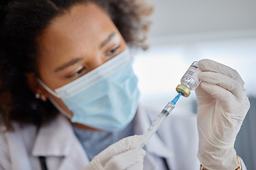 Image showing Smallpox, vaccine and vial with doctor, needle and healthcare safety in hospital. Woman, nurse with face mask and injection for vaccination, virus and bottle for immunity, medical development or help