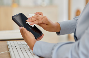 Image showing Woman, hands and cleaning phone in office for mockup space of hygiene, health and virus safety. Closeup of worker wipe dirt on mobile screen with tissue for sanitation, disinfection and dust bacteria