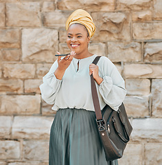 Image showing Cellphone, voice recognition and black woman in the city walking in an urban street with a briefcase. Technology, memo and African female designer recording audio note or message on a phone in a town