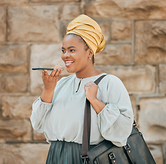 Image showing Young woman on loudspeaker phone call in the city walking in urban street with a briefcase. Voice note, technology and African female designer recording audio memo or message on a cellphone in town.