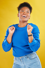 Image showing Happy, dance and young woman in studio for celebration, achievement or goal with confidence. Happiness, smile and African female model moving to music, song or playlist isolated by yellow background.