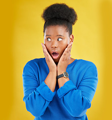 Image showing African girl, surprise and face with news or announcement in isolated or yellow studio background for notification. Wow, gossip and woman with open mouth or omg expression about drama or secret.