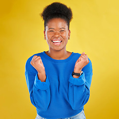 Image showing Excited, celebration and portrait of black woman in studio happy with news, deal and announcement on yellow background. Smile, face and African female winner celebrating lottery, bonus or promotion