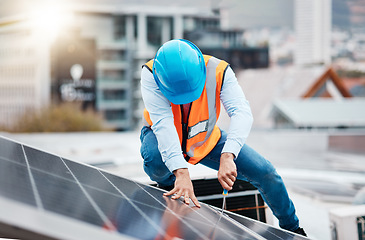 Image showing Engineer man, screwdriver and solar panel on roof for maintenance, industry and construction in city. Technician, tools and photovoltaic system with helmet, development and renewable energy in cbd