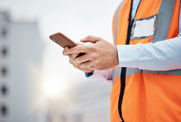 Image showing Phone, engineering and hands of man in city for architecture, construction site and communication. Building, social media and mobile app with closeup of contractor for contact, networking and mockup