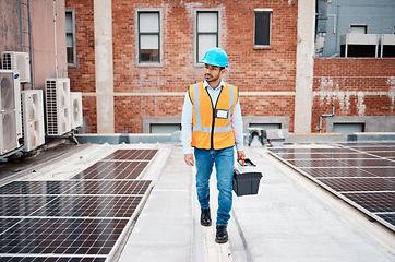 Image showing Solar panel, tool box and inspection with man on roof top for renewable energy, project or power. Construction, electricity or technician with contractor in city for engineering and photovoltaic grid