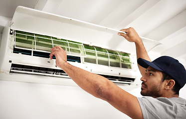 Image showing Maintenance, air conditioner technician and man with filter, working on ventilation or ac repair. Contractor, handyman or electric aircon machine expert problem solving or cleaning dust in office