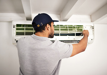 Image showing Maintenance service, air conditioner technician and man, working on ventilation filter or ac repair. Contractor, handyman or electric aircon machine expert problem solving or cleaning dust with tools