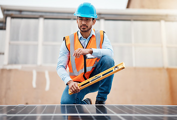 Image showing Solar panel, grid and engineering with man on roof top for renewable energy, project and power. Construction, electricity and sustainability with contractor in city for tools, photovoltaic and safety