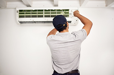 Image showing Maintenance, air conditioning technician and man from back working on ventilation filter for ac repair. Contractor, handyman or electric aircon machine expert problem solving, electrician with tools.