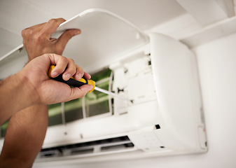 Image showing Maintenance, air conditioner and hands of man with screwdriver working on ventilation filter for ac repair. Contractor service, handyman or electric aircon machine expert problem solving with tools.