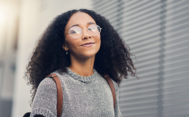 Image showing Woman, portrait and city travel of student with glasses on a street with freedom. Urban, university holiday and happy face of young African person walking with backpack on adventure vacation outdoor