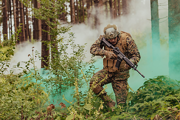 Image showing A modern warfare soldier on war duty in dense and dangerous forest areas. Dangerous military rescue operations