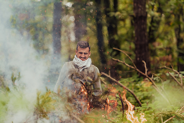 Image showing Angry terrorist militant guerrilla soldier warrior in forest