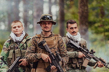 Image showing Goup of soldiers in oposit sides celebrating peace after battle