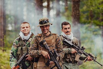 Image showing Goup of soldiers in oposit sides celebrating peace after battle