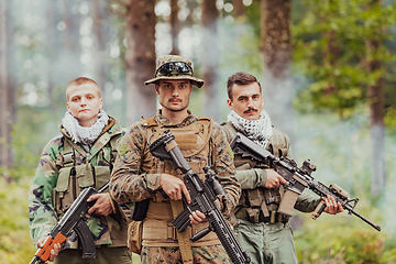 Image showing Goup of soldiers in oposit sides celebrating peace after battle