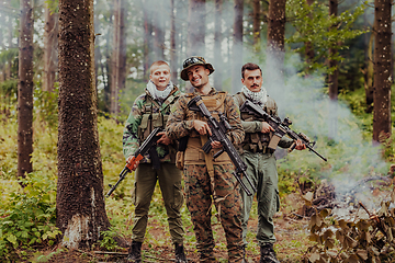 Image showing Goup of soldiers in oposit sides celebrating peace after battle