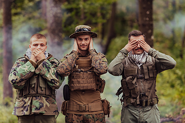 Image showing Group of soldiers in oposit sides celebrating peace after battle by showing blind mute and deaf symbols